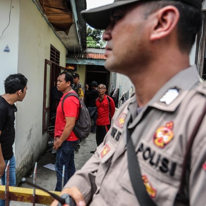 Police inspect a house after a suicide bombing in Medan city on November 13, 2019. Photo: EPA-EFE