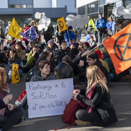 Extinction Rebellion climate change activists block an entrance to general aviation terminal at the Geneva Airport. Photo: EPA-EFE
