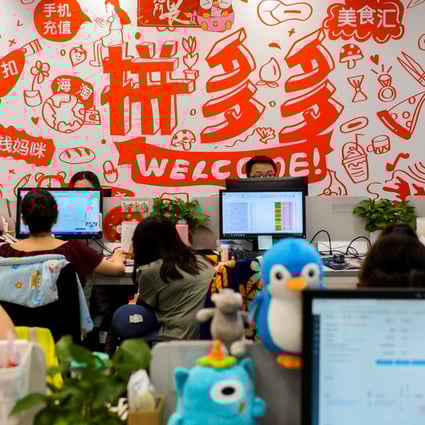 Staff of e-commerce services provider Pinduoduo are seen at their desks at the company’s headquarters in Shanghai. Photo: Reuters