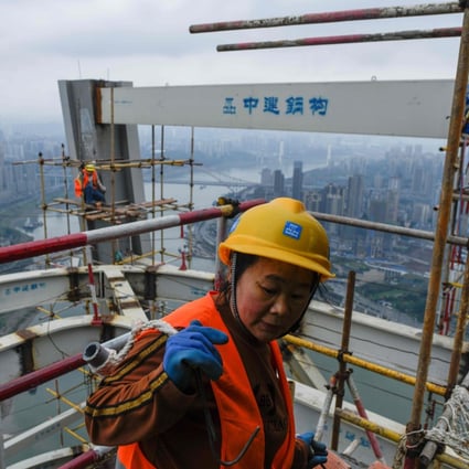 Construction workers in Chongqing, China, on March 22. The fate of China’s economic war with the US depends less on the trade deals negotiated and more on whether China can prevent a property market collapse. Photo: AFP
