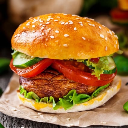 A vegetarian burger with grilled champignon, tomato and cucumber. Photo: Alamy