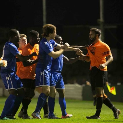 Players square up during a Sporting Bengal (orange shirts) game in the English lower leagues. Photo: Alan Zaman