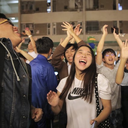 Pro-democracy supporters celebrate huge gains in the district council elections. Photo: AP