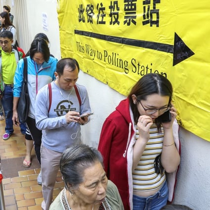 People queue up for the district council election at polling stations in Aberdeen Sports Centre. Photo: May Tse