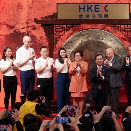 Daniel Zhang Yong, Chief Executive Officer of Alibaba Group attends the company's stock trading debut at the Hong Kong Exchanges and Clearing on November 26, 2019. He is flanked by board member Tung Chee-hwa and Laura Cha Shih May-lung, chairwoman of HKEX. Photo: Sam Tsang