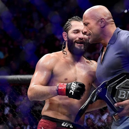 Jorge Masvidal is awarded the ‘BMF’ belt by Dwayne ‘The Rock’ Johnson after his victory by TKO on a medical stoppage against Nate Diaz at UFC 244. Photo: AFP