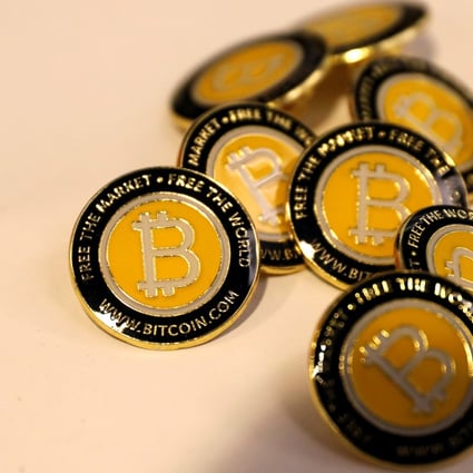 Bitcoin.com buttons are seen displayed on the floor of the Consensus 2018 blockchain technology conference in New York City, US, May 16, 2018. Photo: Reuters