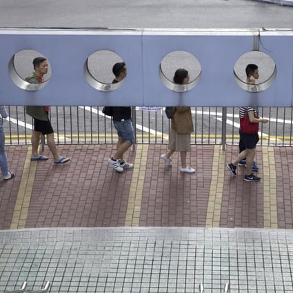People line up to vote outside a polling station for the Hong Kong district council elections on November 24. Photo: AP