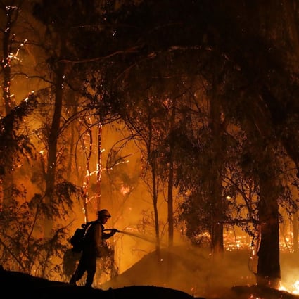 A firefighter battles a blaze in California. Photo: AP