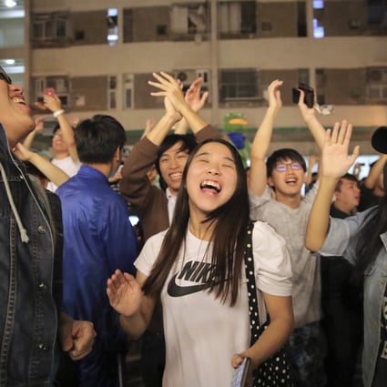 Pro-democracy supporters celebrate on November 25, a day after Hongkongers turned out in force to give opposition candidates a landslide win at the district council elections. Photo: AP