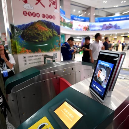 A man gets ready to walk through a subway turnstile equipped with a face scan payment system at Zijingshan station in Zhengzhou, Sept. 27, 2019. Photo: Xinhua
