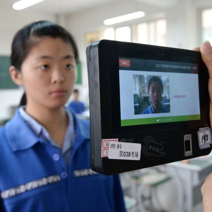 Both fingerprint and facial recognition technology are used in this device to check the identification of a student in China. Photo: AFP
