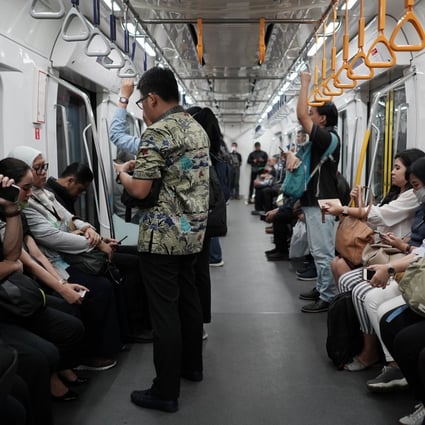 Passengers on board a Jakarta Mass Rapid Transit train. Photo: Bloomberg