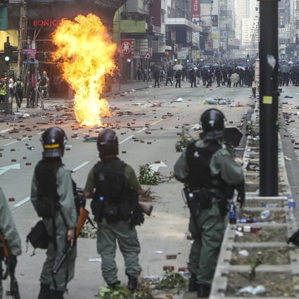 Clashes break out between Hong Kong protesters and riot police on Nathan Road in Tsim Sha Tsui on November 18. Photo: Winson Wong