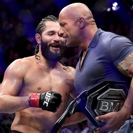 Jorge Masvidal is awarded the ‘BMF’ belt by Dwayne ‘The Rock’ Johnson after his victory by TKO on a medical stoppage against Nate Diaz at UFC 244. Photo: AFP