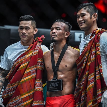 Martin Nguyen (left) and Aung La N Sang celebrate with Tial Thang. Photos: One Championship
