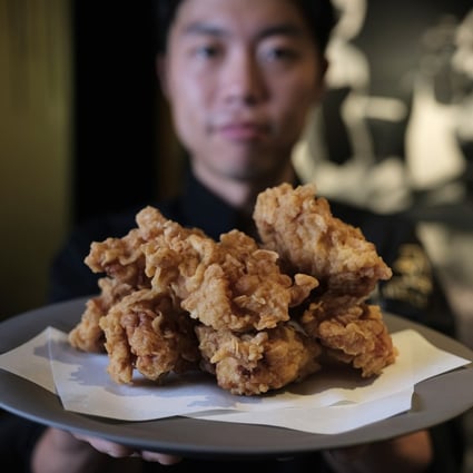 Chef Yong Soo-do with his Korean fried chicken, whose preparation includes marinating it overnight in brine, then putting it in a tempura batter with home-made chicken powder. Photo: Tory Ho