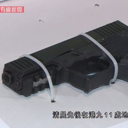 Police say they seized this 9mm pistol and other weapons during raids on Sunday morning. Photo: Cable TV News