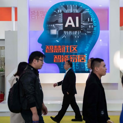 Visitors walk past a stand with artificial intelligence cameras at the 14th China International Exhibition on Public Safety and Security in Beijing on October 24. Photo: Agence France-Presse