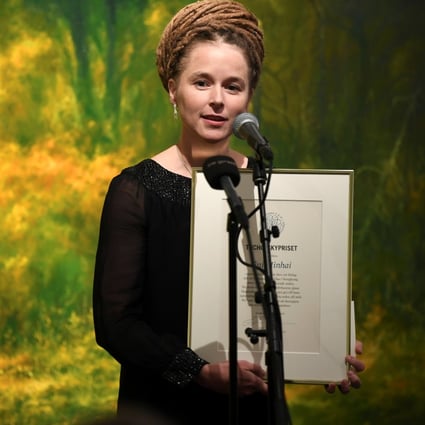 Swedish Minister for Culture and Democracy Amanda Lind presents the Tucholsky Prize to detained bookseller Gui Minhai in Stockholm on November 15. Photo: Reuters