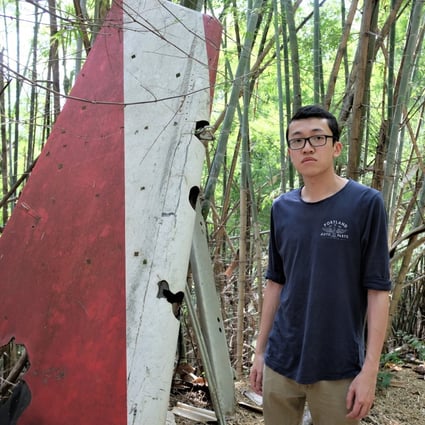 Felix Wong, a Hong Kong-born Canadian, in a jungle in Suphanburi, Thailand, beside a vertical stabiliser that belonged to the Lauda Air Flight 004 plane that crashed on its way from Hong Kong to Vienna in 1991. His aunt was among the 223 people killed. Photo: Tibor Krausz