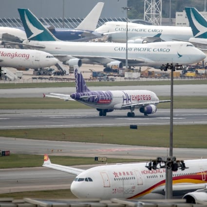 A Hong Kong Express Airways Ltd. aircraft taxis past a Hong Kong Airlines Ltd. aircraft, foreground, and a Cathay Pacific Airways Ltd. cargo aircraft at Hong Kong International Airport in Hong Kong, China, on Tuesday, March 5, 2019. Cathay is in talks to buy shares in Hong Kong's only budget airline Hong Kong Express from Chinese conglomerate HNA Group Co., as Asia's biggest international carrier seeks to gain a foothold in the region's booming low-cost travel market. Photo: Bloomberg
