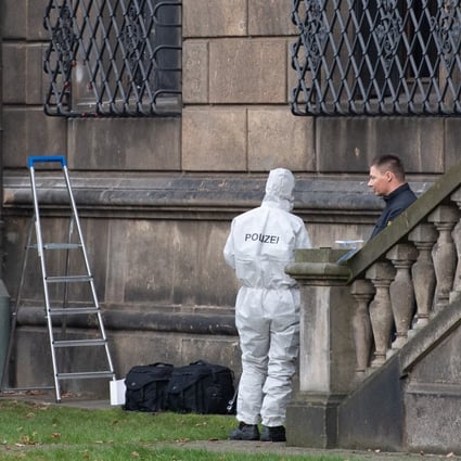 Police investigate near the damaged window lattice at the Green Vault at Dresden Castle in November. Photo: dpa