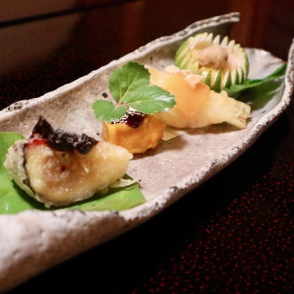 The sushi at Michelin-starred Ajiro is served with several side dishes and is elegantly prepared. Photo: Kayla Hill
