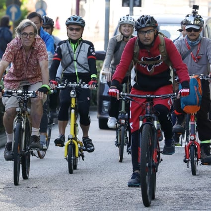 The “bike train” group cycle through Lai Chi Kok in Kowloon, Hong Kong, during their 15km bicycle commute from Tsim Sha Tsui to Tsuen Wan. A Hongkonger who founded a group to promote biking in London launched the initiative recently. Photo: Roy Issa