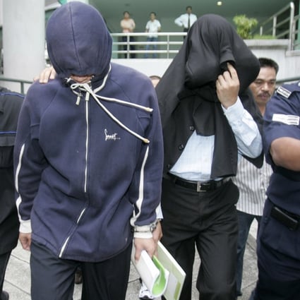 Policemen Azilah Hadri and Sirul Azhar Umar arrive at court. In 2009 both were convicted and sentenced to death. Photo: Reuters
