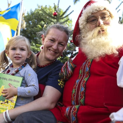 Swedish consul general Helena Storm with Father Christmasat the Hong Kong Cultural Centre Piazza in Tsim Sha Tsui. Photo: Dickson Lee