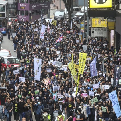 Social workers march from Central to Wan Chai on Thursday. Photo: K.Y. Cheng
