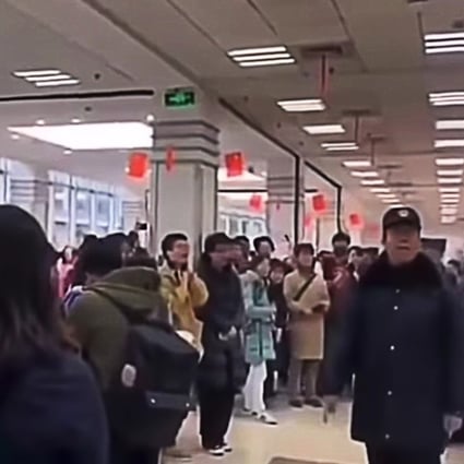 A screengrab of the censored video clip showing dozens of students taking part in a flash mob demonstration against changes to Fudan University’s charter. Photo: YouTube