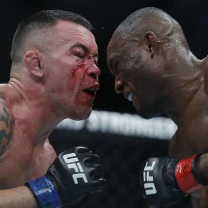 Colby Covington (left) battles with UFC welterweight champion Kamaru Usman at UFC 245. Photo: AFP