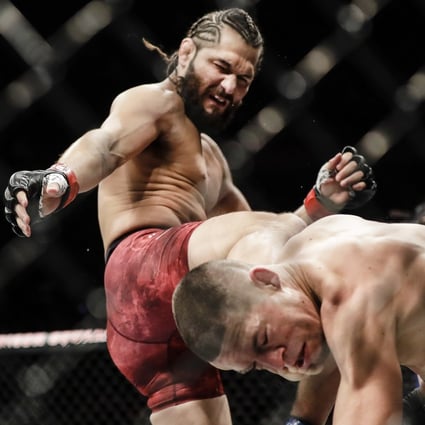 Jorge Masvidal kicks Nate Diaz during the first round at UFC 244. Photo: AP