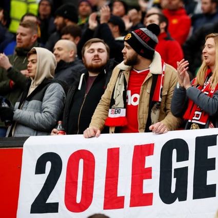 Manchester United fans display a banner in support manager Ole Gunnar Solskjaer. Photo: Reuters