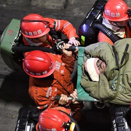 Rescuers carry a survivor of a flooding accident in a coal mine in Sichuan province last week. Photo: Xinhua