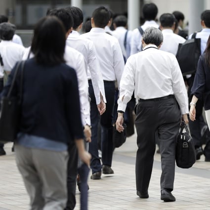 Morning commuters pictured in Tokyo, Japan. Photo: Bloomberg