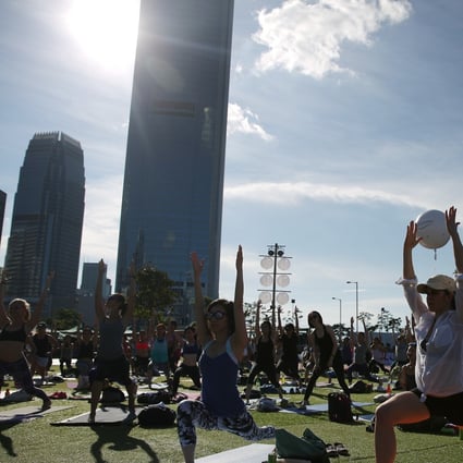 There are plenty of opportunities to do yoga in public places in Hong Kong with groups like HK Outdoor Yoga popping up at public parks. Photo: Sam Tsang