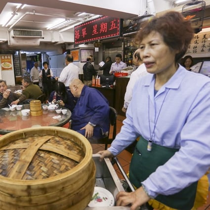 A waitress wheels a dim sum cart at Lin Heung Kui restaurant in Sheung Wan. Priscilla Wong enjoys taking guests to the Sheung Wan restaurant for the old-style dim sum experience. Photo: Jonathan Wong