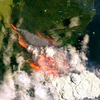A satellite image of the Batemans Bay area shows smoke and flames from bush fires in Australia. Photo: Reuters