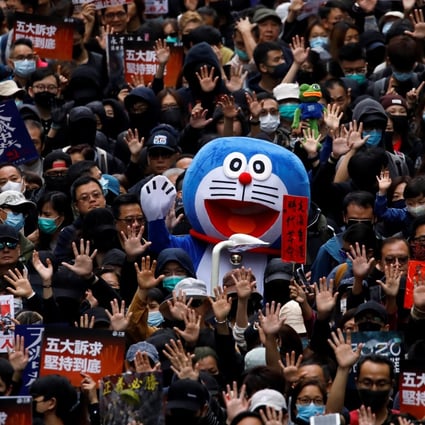 A person dressed as anime character Doraemon attends an anti-government rally in Hong Kong on New Year’s Day. Photo: Reuters