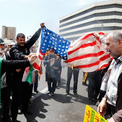 Demonstrators burn a US flag in Tehran, Iran. Tension between the town countries is at breaking point after the US killed a top Iranian military commander in an air strike. Photo: EPA