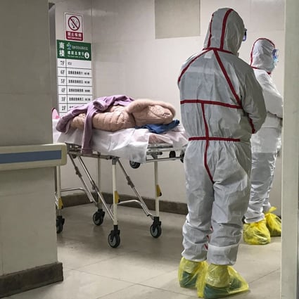 Staff in protective clothing at the hospital in Wuhan where patients are being treated. Photo: Jun Mai