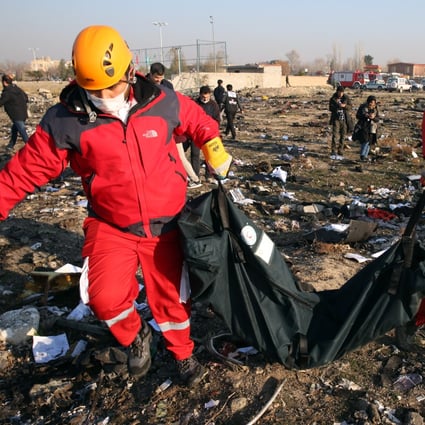 Members of the International Red Crescent work at the site of the wreckage in Shahriar, Iran, on January 8, 2020. Photo: EPA-EFE