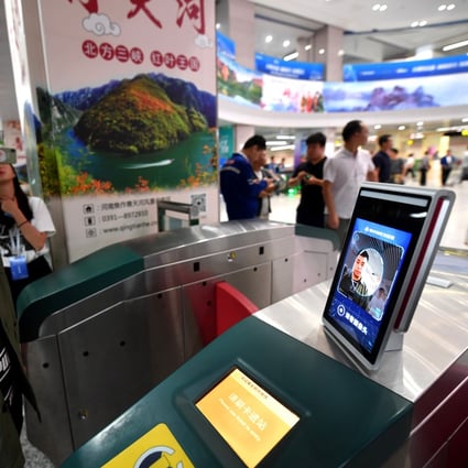 A man gets ready to walk through a subway turnstile equipped with facial recognition payment system at Zijingshan station in Zhengzhou, Henan Province, 2019. Photo: Xinhua