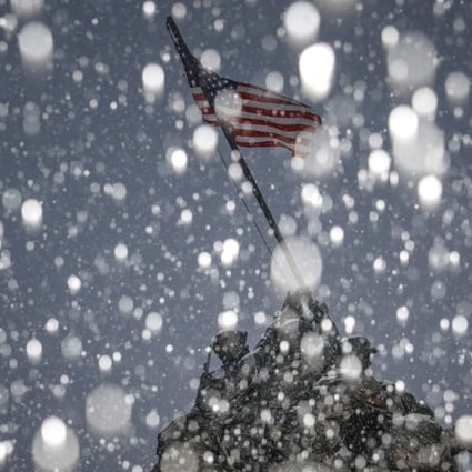 Snow falls during a storm at the Iwo Jima Memorial site in Arlington, Virginia. Photo: Reuters