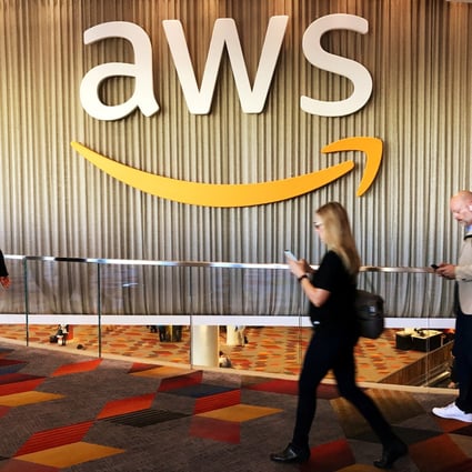 Attendees at Amazon’s annual cloud computing conference walk past the Amazon Web Services logo in Las Vegas US, in November 2017. File photo: Reuters