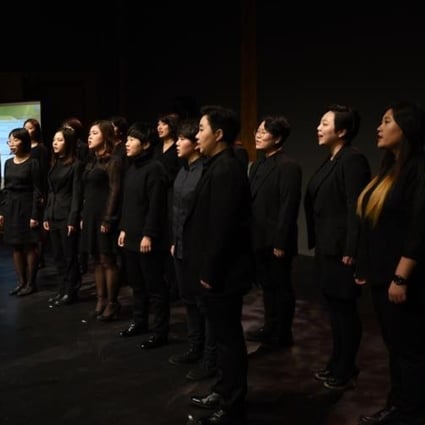 Members of South Korea’s Unnie Choir performs on stage. The choir sings about the joy and stigma of being gay in the socially conservative country.