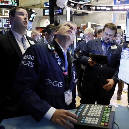 Traders on the floor of the New York Stock Exchange on Wednesday tracking shares after the signing of a trade deal between the US and China. Photo: AP
